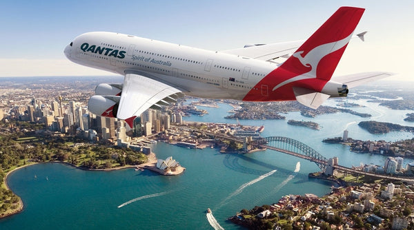Qantas Flight flys over Sydney city